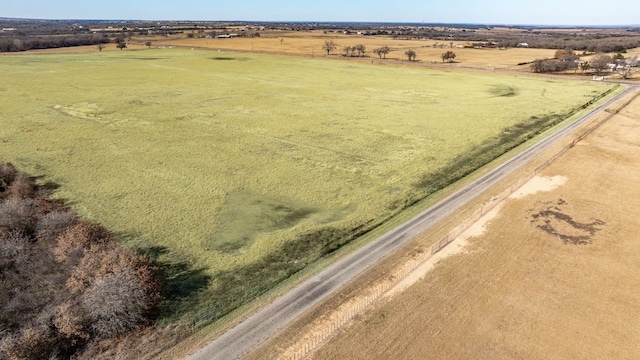 birds eye view of property featuring a rural view