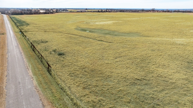 birds eye view of property with a rural view