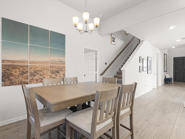 dining area with beamed ceiling and a notable chandelier