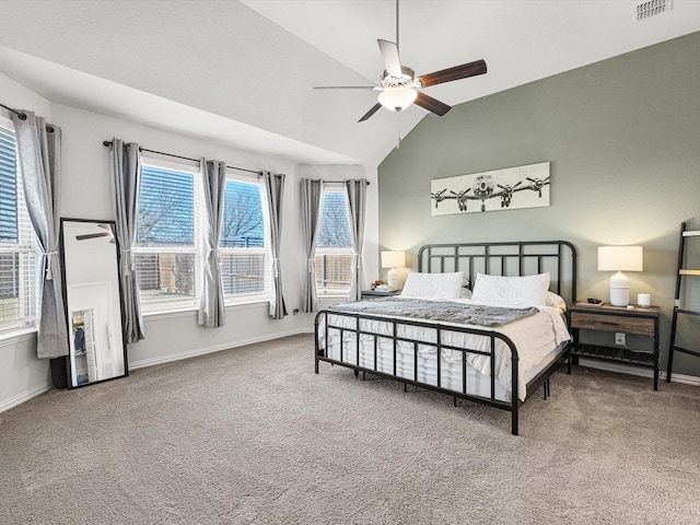 bedroom featuring vaulted ceiling, ceiling fan, carpet, and multiple windows