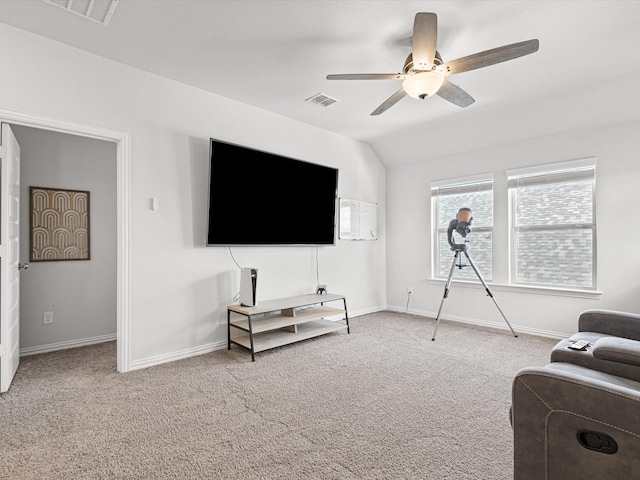 living room featuring ceiling fan, light colored carpet, and lofted ceiling