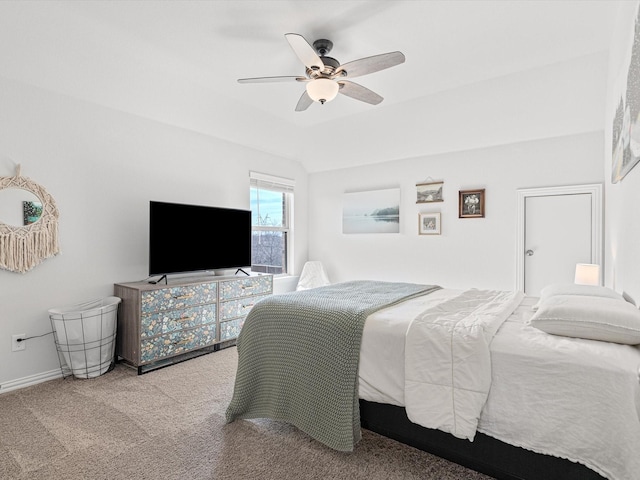 bedroom featuring vaulted ceiling, ceiling fan, and carpet floors