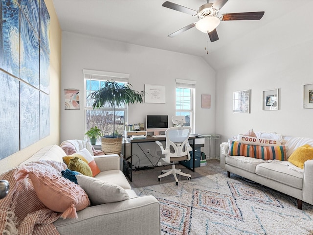 office space with ceiling fan, lofted ceiling, light colored carpet, and radiator heating unit