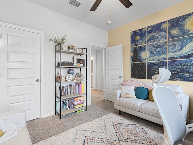 living room with ceiling fan and light carpet