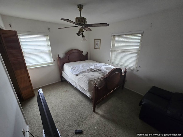 bedroom with ceiling fan and carpet