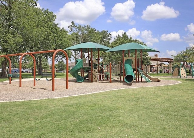 view of jungle gym featuring a lawn