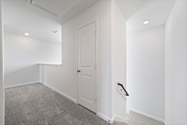 hallway featuring ornamental molding and carpet floors