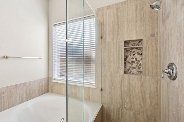 bathroom with separate shower and tub