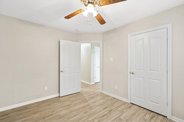 unfurnished bedroom featuring ceiling fan and light hardwood / wood-style flooring