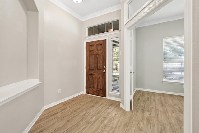 foyer featuring ornamental molding and light hardwood / wood-style floors