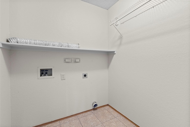 clothes washing area featuring washer hookup, light tile patterned floors, a textured ceiling, and electric dryer hookup