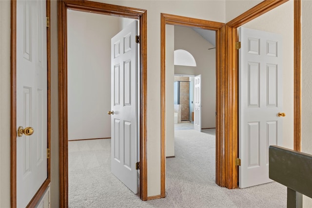 corridor featuring light carpet