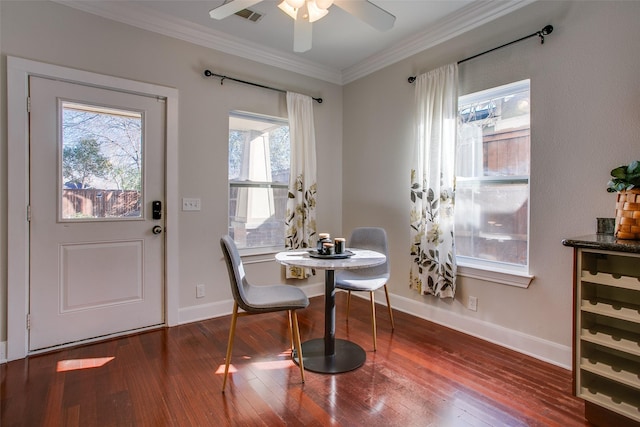 dining room with ceiling fan, ornamental molding, and wood-type flooring