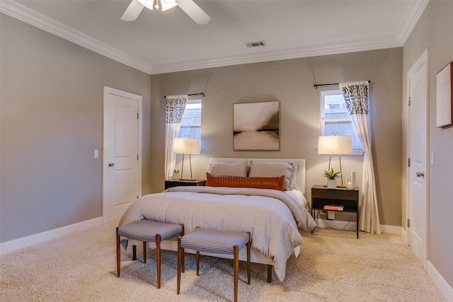 bedroom featuring ceiling fan, ornamental molding, carpet floors, and multiple windows