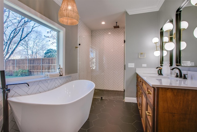 bathroom with vanity, tile patterned flooring, crown molding, and shower with separate bathtub