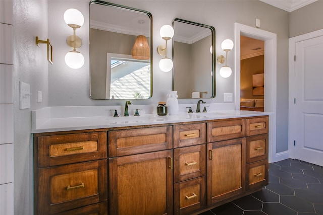 bathroom featuring vanity, crown molding, and tile patterned flooring