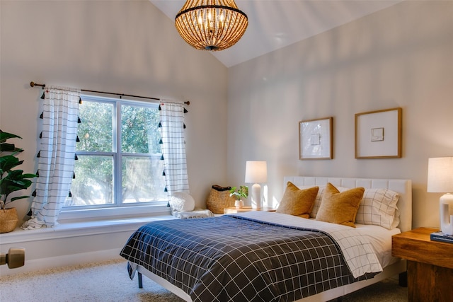 carpeted bedroom featuring lofted ceiling and a chandelier