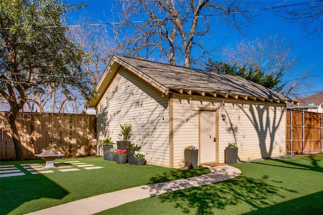 view of outbuilding with a yard