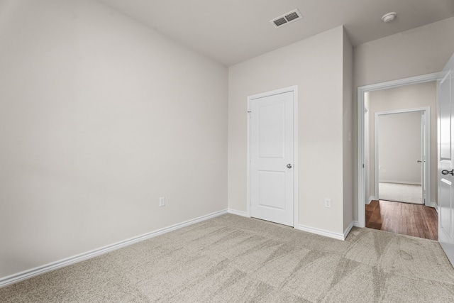 unfurnished bedroom with carpet