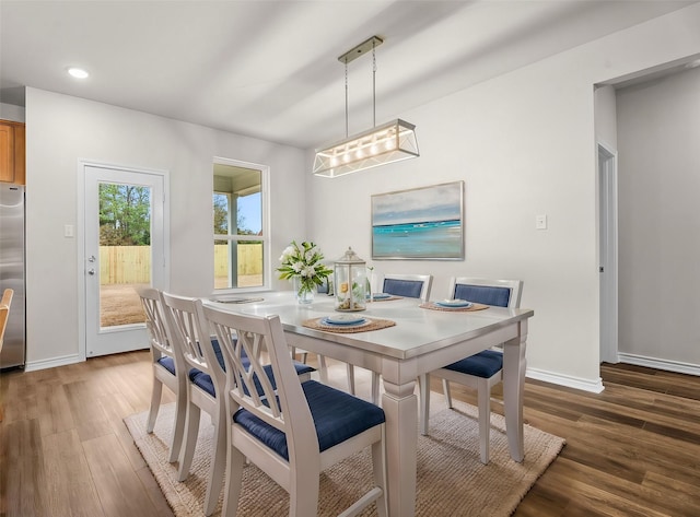 dining space featuring dark wood-type flooring