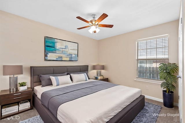 carpeted bedroom featuring ceiling fan