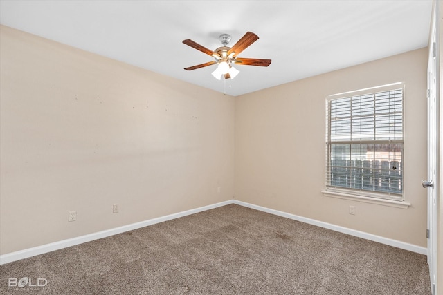 carpeted empty room featuring ceiling fan