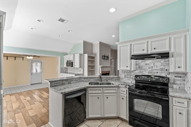 kitchen featuring white cabinetry, light stone countertops, sink, and black appliances