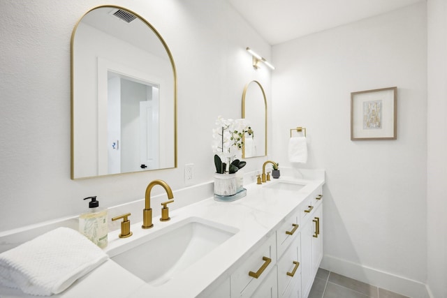 bathroom with tile patterned flooring and vanity