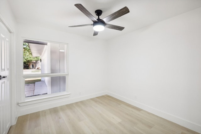 spare room featuring ceiling fan and light wood-type flooring