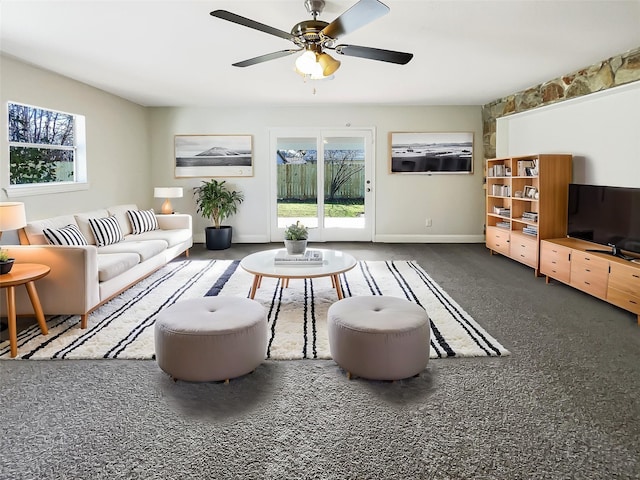 carpeted living room featuring ceiling fan