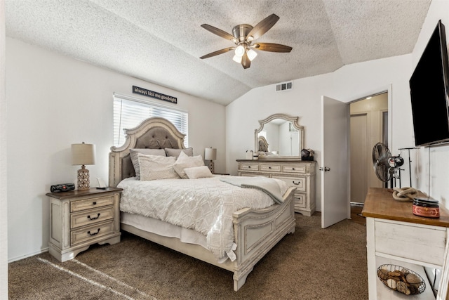 bedroom with lofted ceiling, ceiling fan, dark carpet, and a textured ceiling