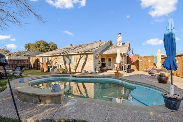 view of pool featuring a patio