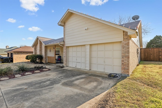 view of front of house with a front lawn and a garage