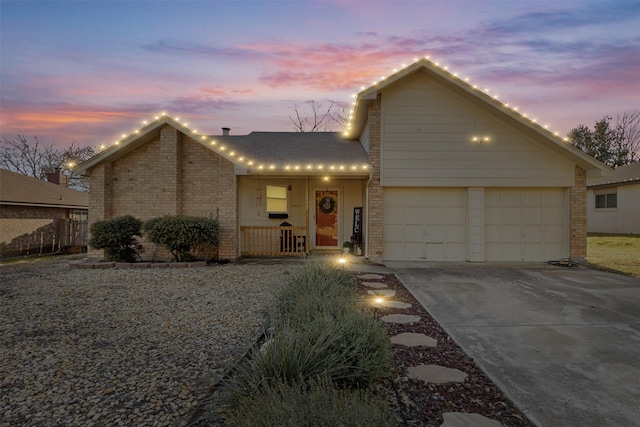 view of front of house featuring covered porch and a garage