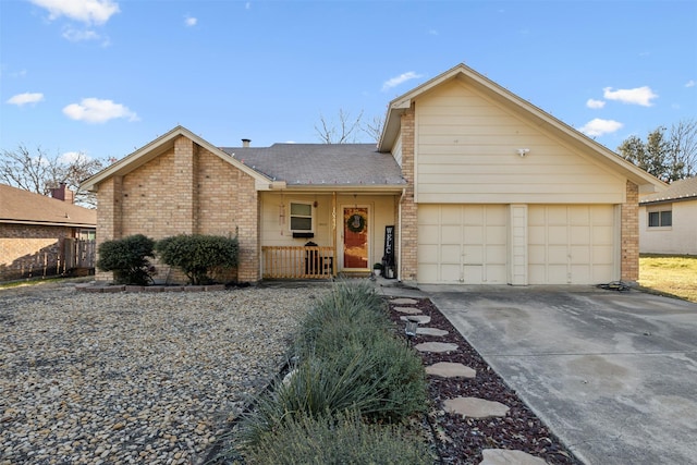 view of front of home featuring covered porch and a garage