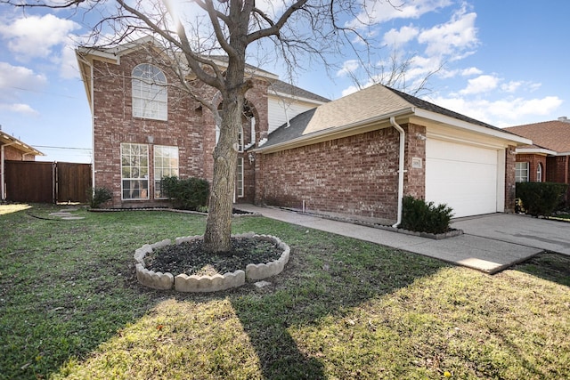 view of property with a garage and a front yard