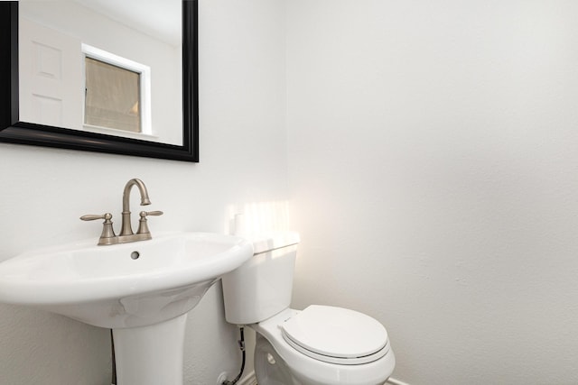 bathroom with sink and toilet