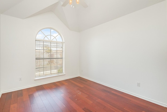 spare room featuring ceiling fan, wood-type flooring, and vaulted ceiling