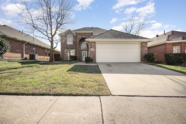 view of front facade featuring a front yard, a garage, and central AC