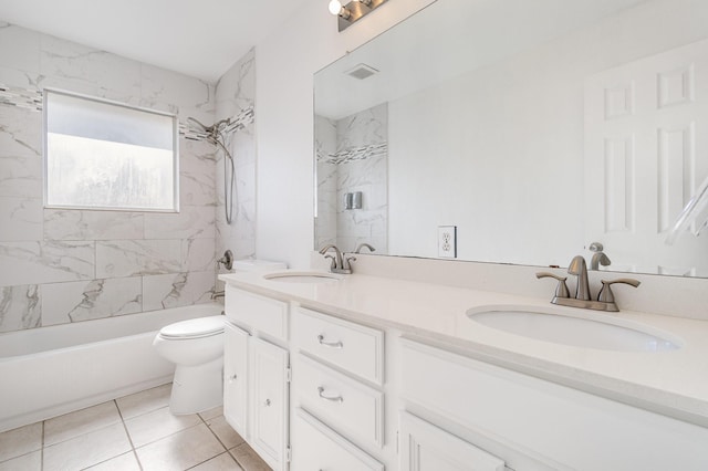 full bathroom featuring toilet, tile patterned flooring, tiled shower / bath combo, and vanity