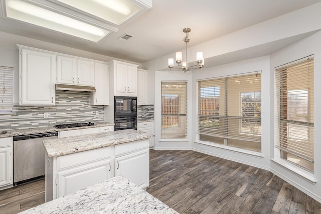 kitchen with decorative light fixtures, decorative backsplash, white cabinets, and black appliances