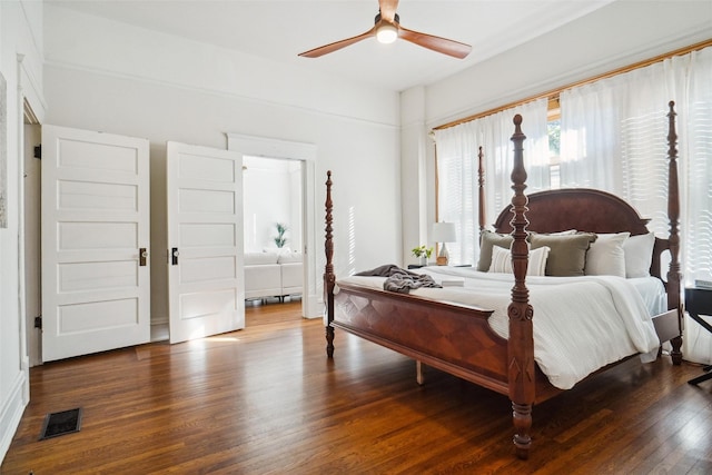 bedroom featuring dark wood-type flooring and ceiling fan