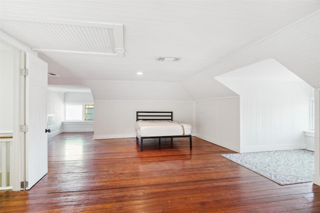 bonus room with hardwood / wood-style flooring and lofted ceiling