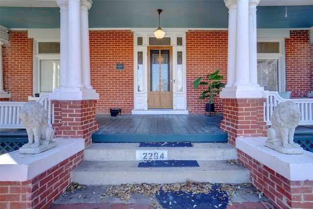 doorway to property with covered porch