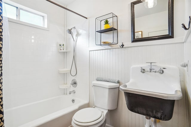 full bathroom with sink, shower / tub combo, and toilet