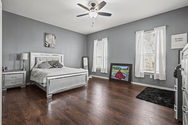 bedroom featuring ceiling fan and dark wood-type flooring