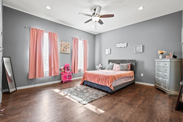 bedroom with ceiling fan and dark hardwood / wood-style flooring