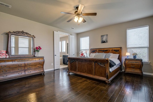 bedroom featuring ceiling fan, dark wood-type flooring, and ensuite bathroom