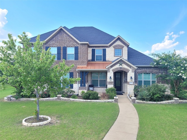 view of front of property with a front lawn