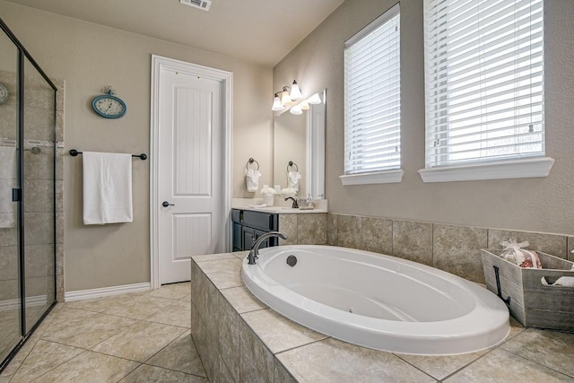 bathroom featuring shower with separate bathtub, tile patterned floors, and vanity